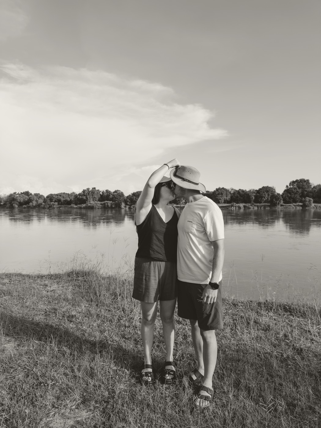 Jacques and Lara sharing a quiet moment by a lake.